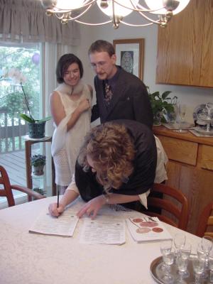 Marketa, Jirka, Elizabeth signing the marriage certificate